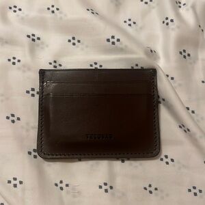 This is a brown leather tecovas card holder